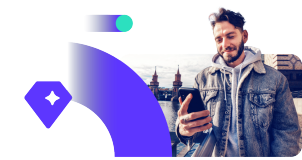 Young adult men in the city using smartphone.