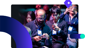 SAP TechEd Berlin Attendees looking on their phones and taking pictures at the event