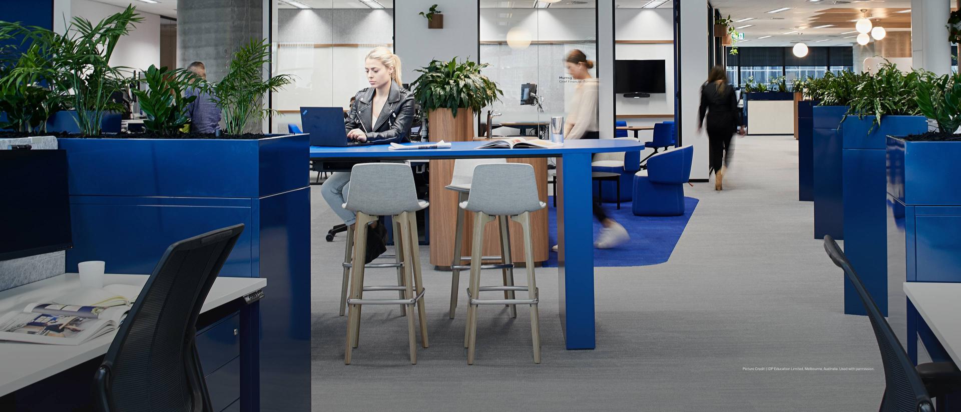 People working in an open-concept office