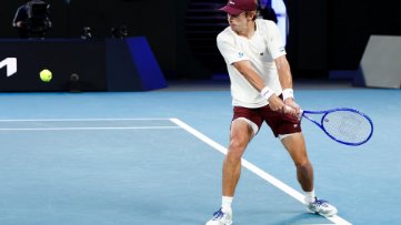 Alex de Minaur playing tennis