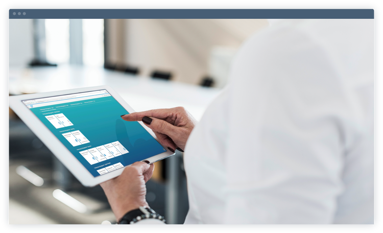 A person managing data on a tablet.