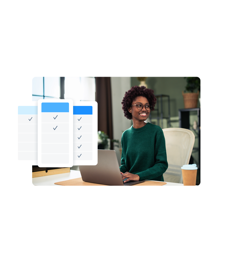 woman with a laptop looking away and smiling